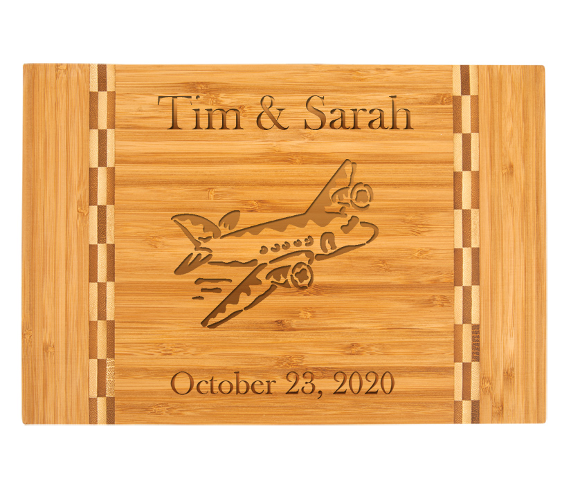 Custom engraved bamboo cutting board with engraved airplane design and personalized text. Airplane Cutting Board