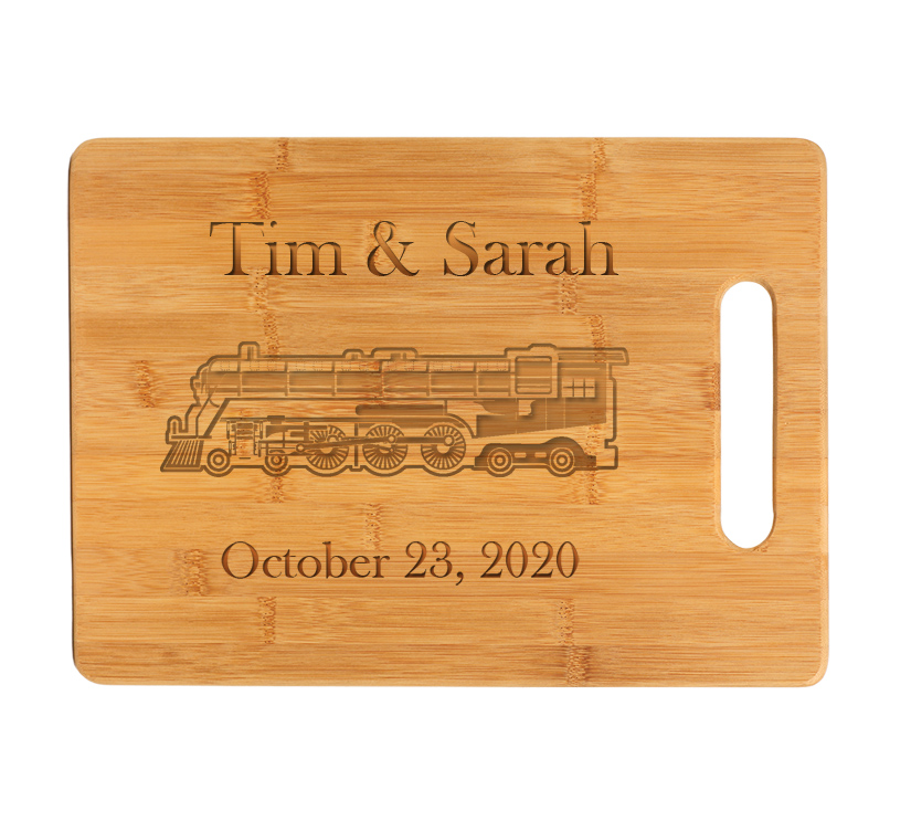 Custom engraved bamboo cutting board with engraved train design and personalized text. Train Cutting Board