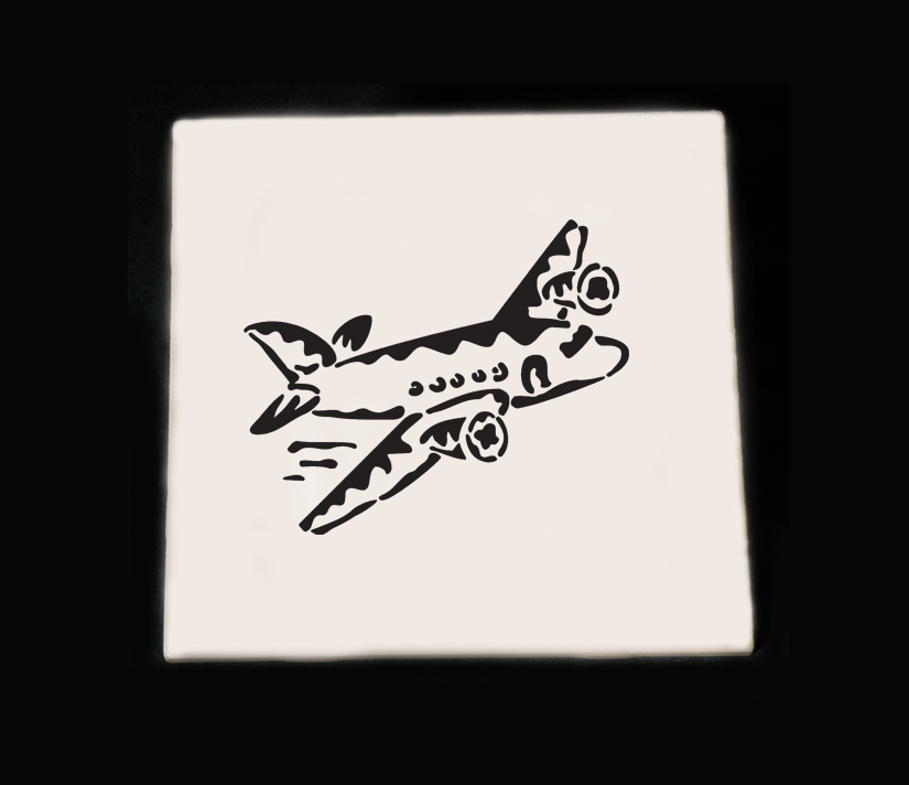 Personalized ceramic trivet with an engraved airplane design and custom text. Airplane Trivet