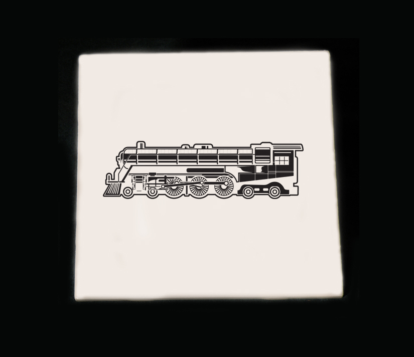 Personalized ceramic trivet with an engraved train design and custom text.
