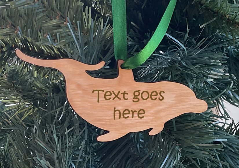 Wood dolphin Christmas ornament with your choice of wood type, size and personalized text. Dolphin Ornament