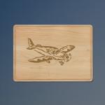 Custom engraved maple drip ring airplane  cutting board with a airplane design and personalized text. 85+ airplane designs to choose from.